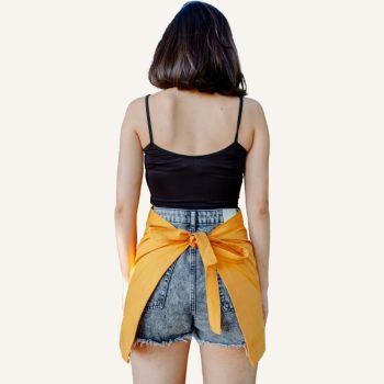 back side of yellow half apron