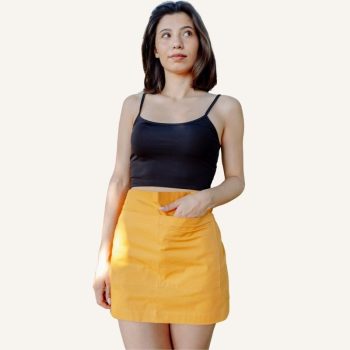 young girl wears yellow half apron